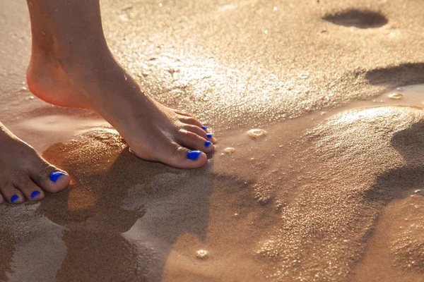 Beautiful pedicure on the sea sand — Stock Photo, Image