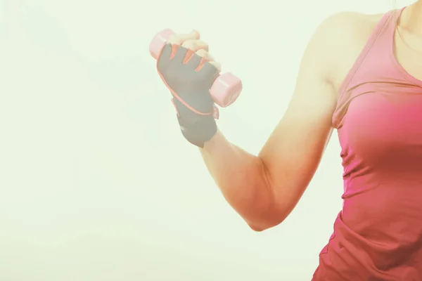 Muscular female body with sweat