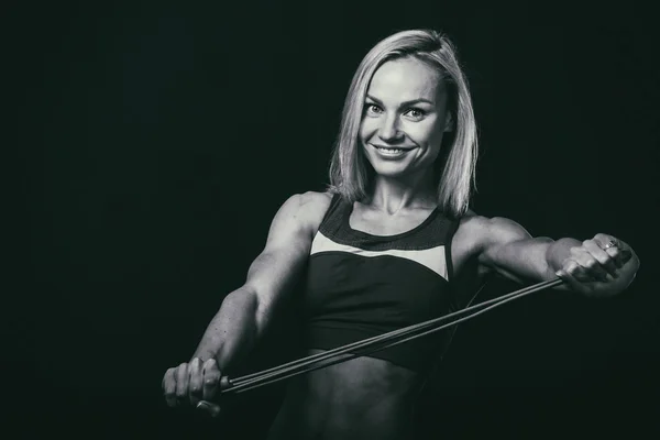 Figure fitness girl on a dark background. — Stock Photo, Image