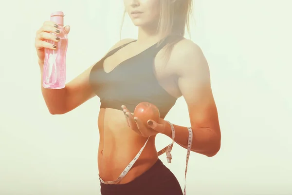 Sexy fitness woman on a light background. — Stock Photo, Image