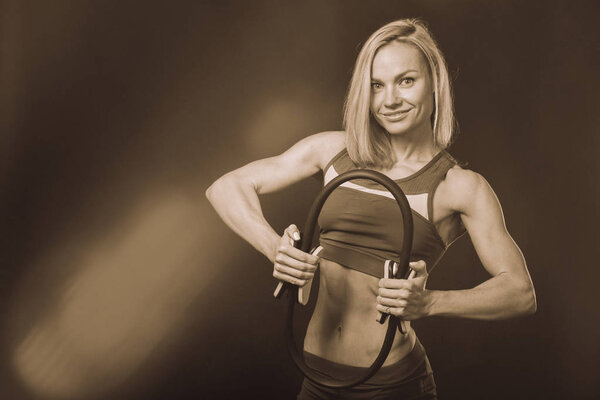 Girl with fitness equipment on a white background