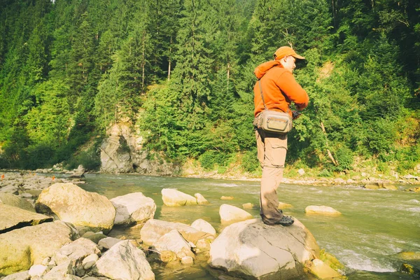 Fishing in a mountain river — Stock Photo, Image