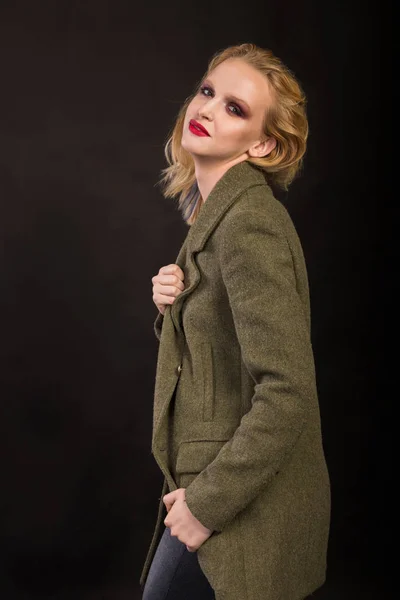 Sexy blond in a coat — Stock Photo, Image