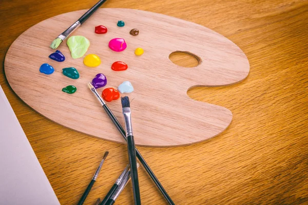 artist Tools on a wooden background.