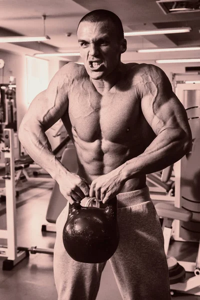 A man with a barbell exercise on biceps — Stock Photo, Image