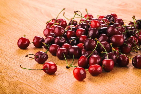 Cherry on a wooden background — Stock Photo, Image