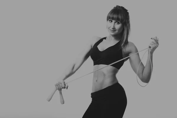 Fitness girl posing on a light background — Stock Photo, Image