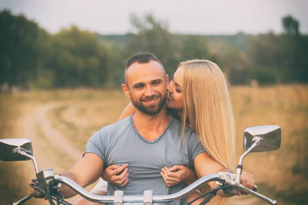 Travel and love, passion, bike road. Couple in love on the road with a motorcycle. Boy and girl in love. — Stock Photo, Image