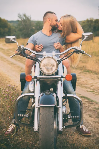 Travel and love, passion, bike road. Couple in love on the road with a motorcycle. Boy and girl in love. — Stock Photo, Image