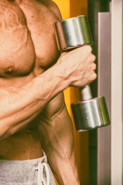 Strong with muscular body at the gym — Stock Photo, Image