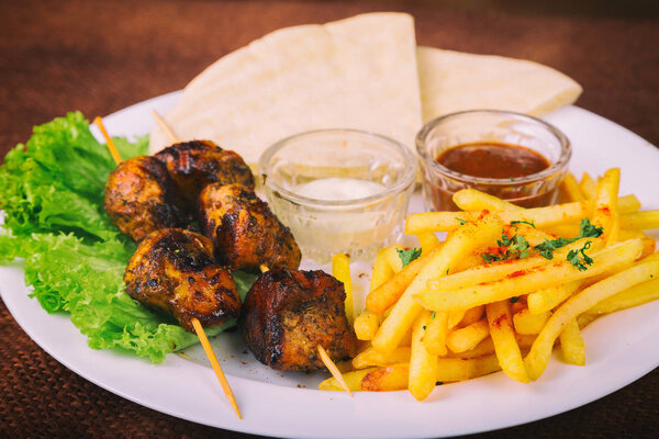 French fries and shish kebab