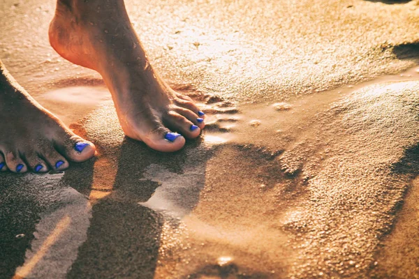 Beautiful pedicure on the sea sand — Stock Photo, Image