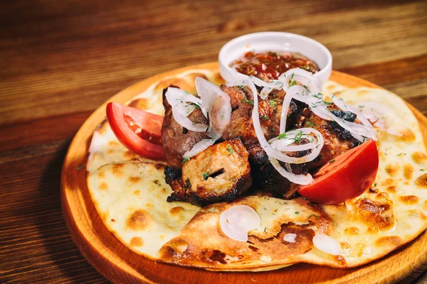 Shish kebab on pita bread