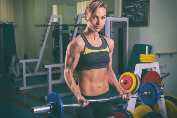 Chica con equipo de fitness sobre un fondo blanco — Foto de Stock