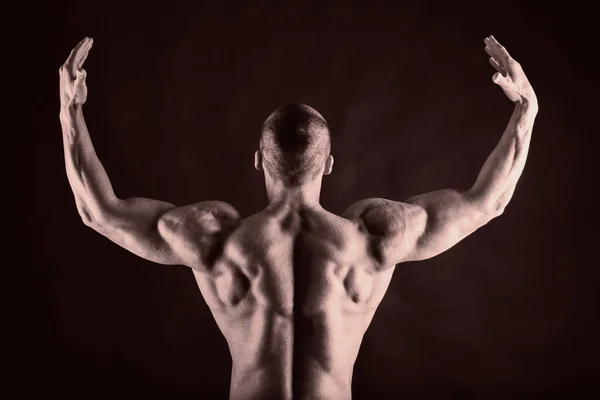 Bodybuilder on black — Stock Photo, Image