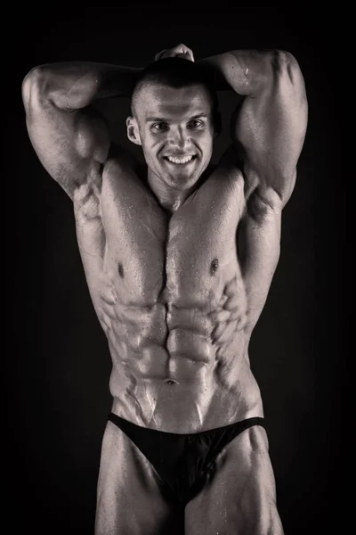 Bodybuilder on black — Stock Photo, Image