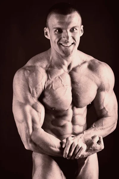 A beautiful man's pumped body. The concept of bodybuilding — Stock Photo, Image