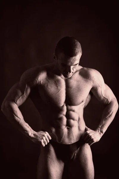A beautiful man's pumped body. The concept of bodybuilding — Stock Photo, Image