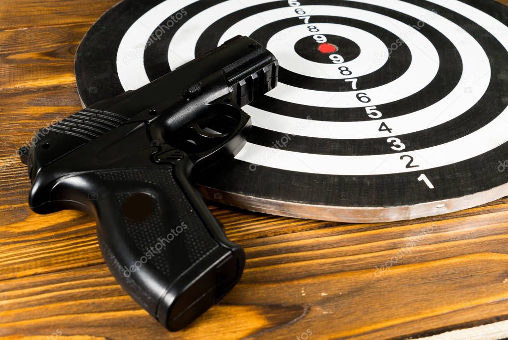 Air gun  and a target on the table