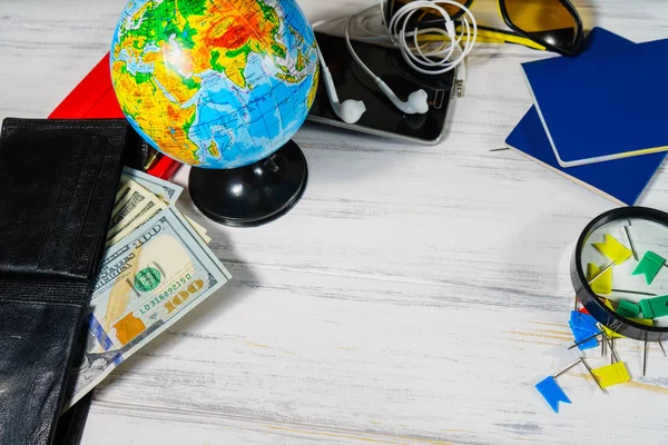 Travel concept. Globe, money preparing for a trip
