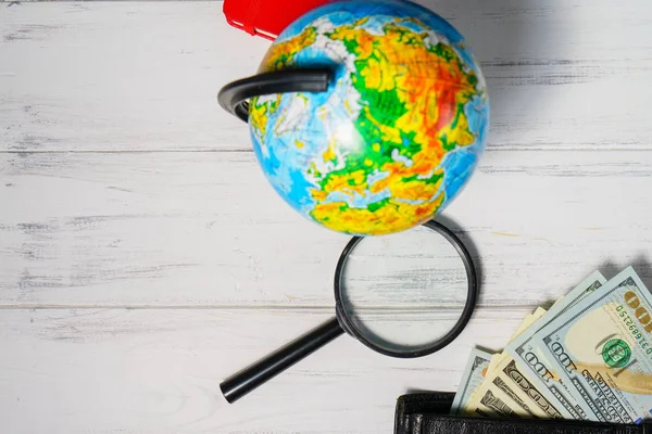 Travel concept. Globe, money preparing for a trip