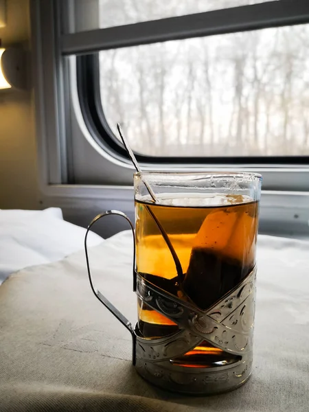 Tea in a glass beaker on a train