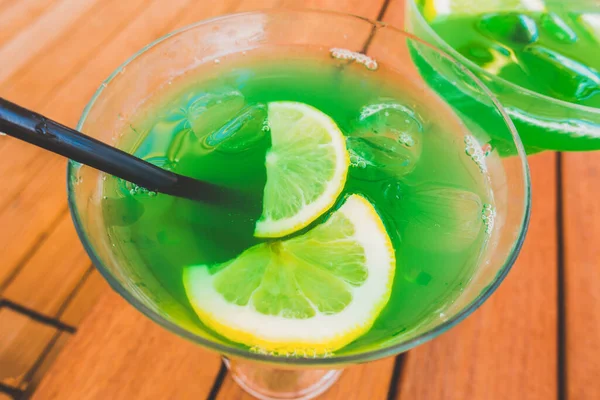 Beautiful green cocktail in a summer cafe