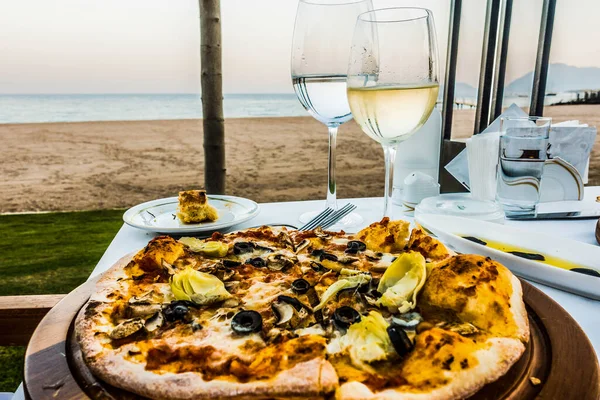 Pizza and wine. sea vacation  travel background