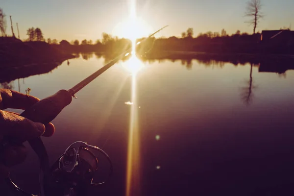 Pike fishing on the lake. Fishing recreation