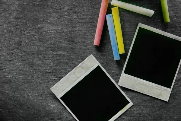 Blank blackboard with colored chalks — Stock Photo, Image