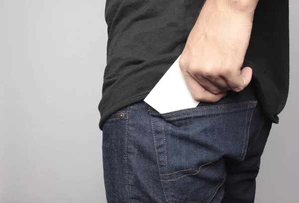 Pulling card on back pocket — Stock Photo, Image