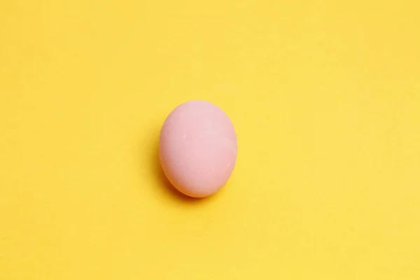Preserved egg on yellow background