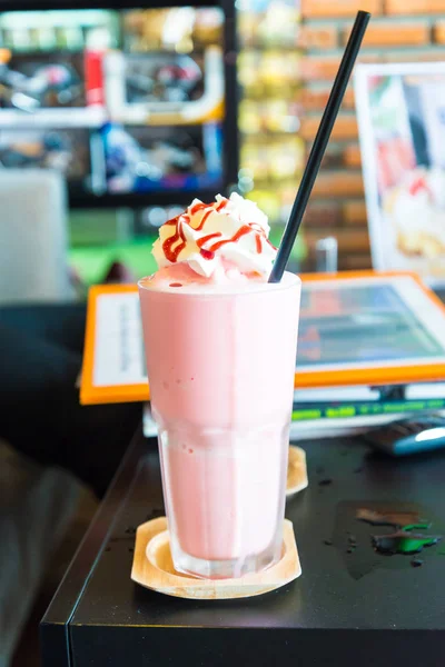 Ice Strawberry Smoothie on the wooden table. — Stock Photo, Image