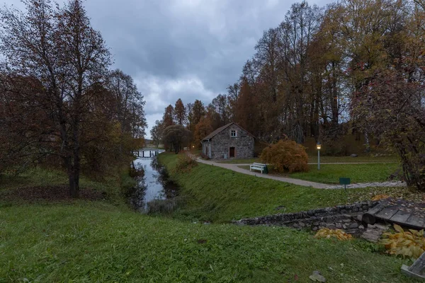 Stone house by the pond on the territory of the Museum - estate of A. S. Pushkin Mikhailovskoye Pskov region, Pushkin hills.