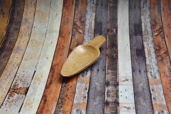 A small brown spoon made of wood — 图库照片