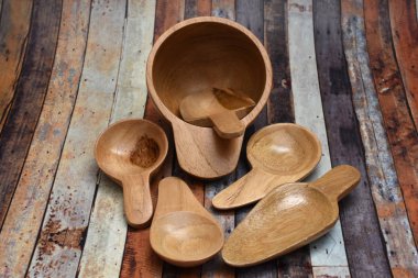 A small brown spoon made of wood