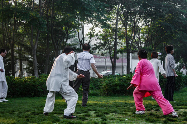 Early morning Tai Chi exercise in park