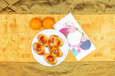 Kurtlu Osmanthus Jölesi. Ay Çin 'in yeni yıl atıştırmalıkları. Yemekten sonra tatlı serinletiyor. Kırmızı paketlerle kutlama.