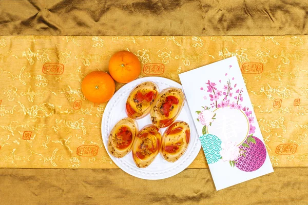 Kurtlu Osmanthus Jölesi. Ay Çin 'in yeni yıl atıştırmalıkları. Yemekten sonra tatlı serinletiyor. Kırmızı paketlerle kutlama.