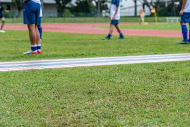Futbol maçından önce ısınan futbolcuların arka planı bulanıklaştı