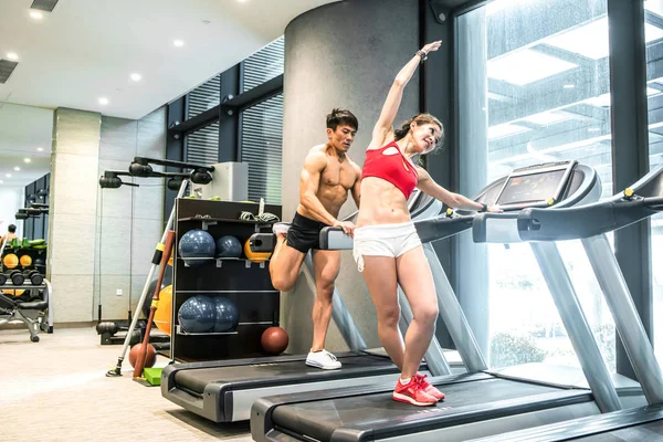 Active Asian people man and woman personal trainer on ru — стоковое фото
