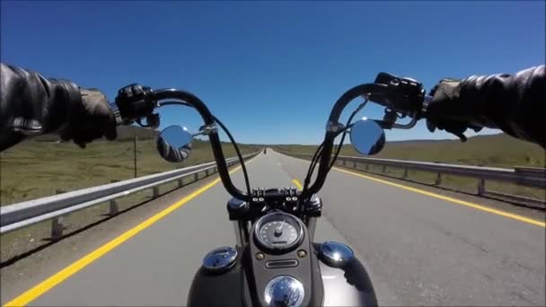 First person pov view on professional biker riding fast downhill on magnificent highway road on black sport motor bike — Stock Video