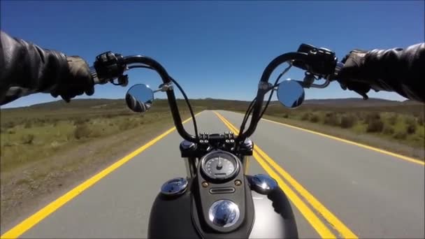 First person pov view on professional biker riding fast downhill on spectacular highway road on black sport motor bike — Stock Video