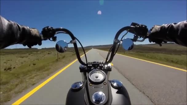 First person pov shot of professional biker riding fast downhill highway road on black motor bike in wonderful landscape — Stock Video