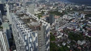 Tall modern urban skyscraper tower buildings of Bangkok Thailand downtown in fascinating aerial drone cityscape flyover