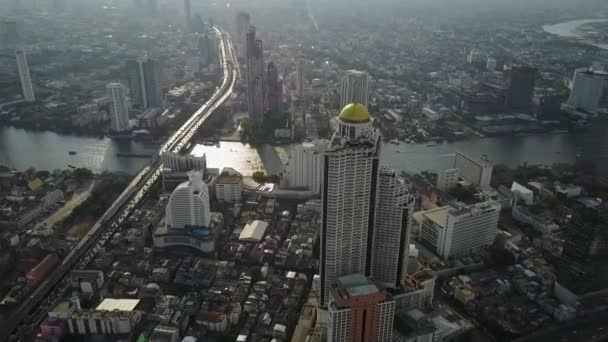 Urban tall modern skyscraper tower buildings of Bangkok Thailand downtown in picturesque aerial drone cityscape flyover — Stock Video