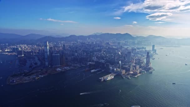 近代的な建築物の上に優れた無人偵察機の都市の空のパノラマフライト朝の日差しの中で香港市 — ストック動画