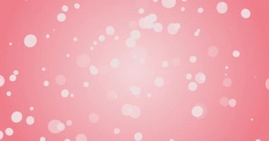 Hareket eden ışık parçacıkları ile parlayan pembe bokeh arkaplanı.