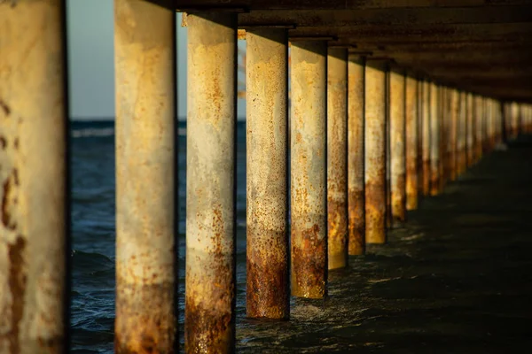 View under a jetty on a sunny evening. — ストック写真