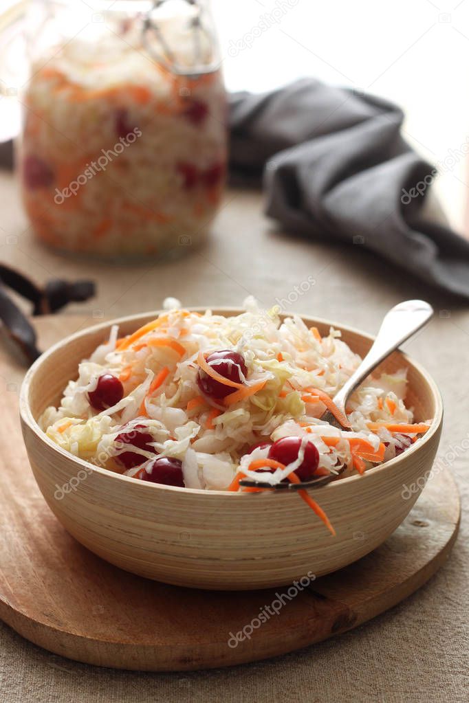 Homemade Traditional sauerkraut with carrots and cranberries.Vegan salad rustic style 